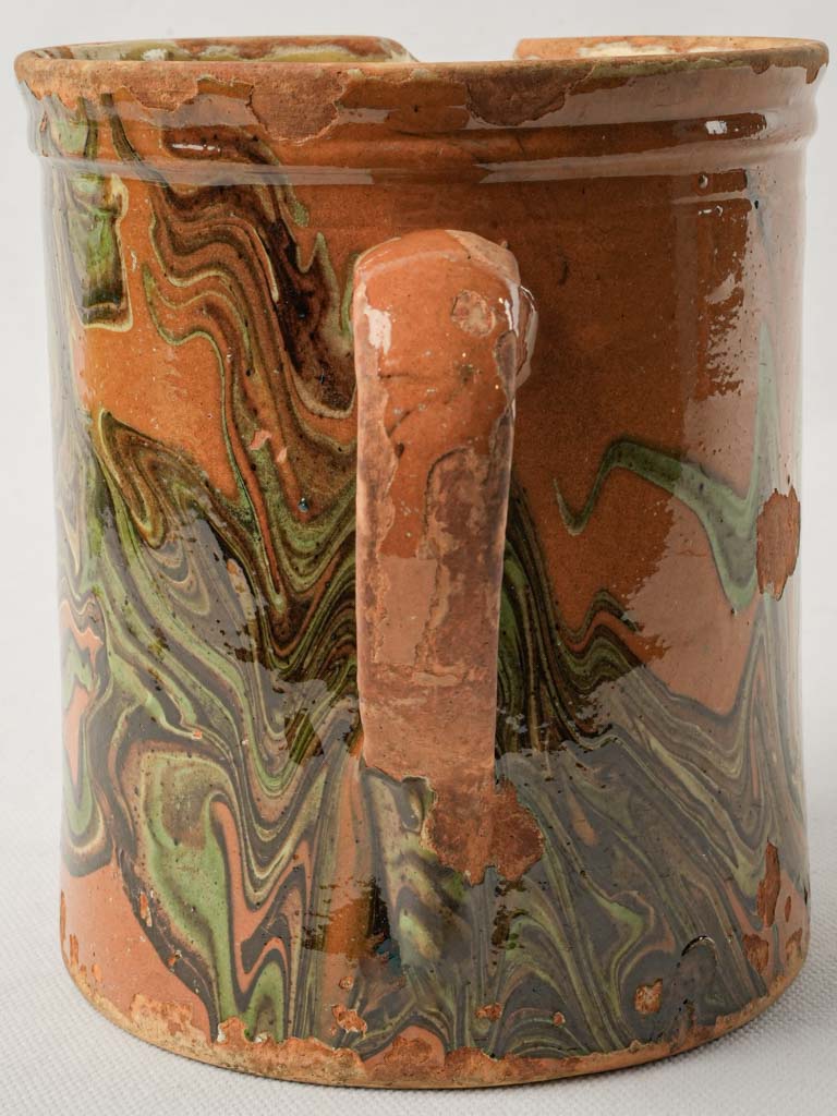 Textured brown and green pitcher