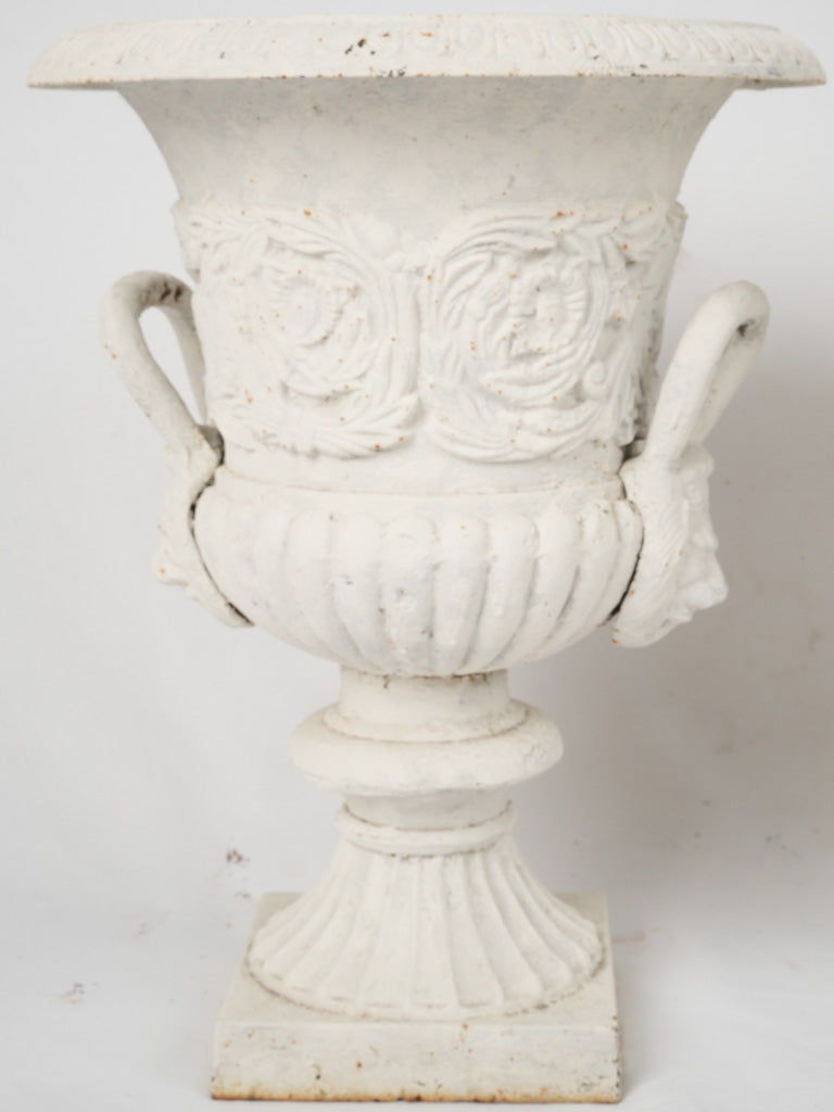 Charming weathered entryway iron urns