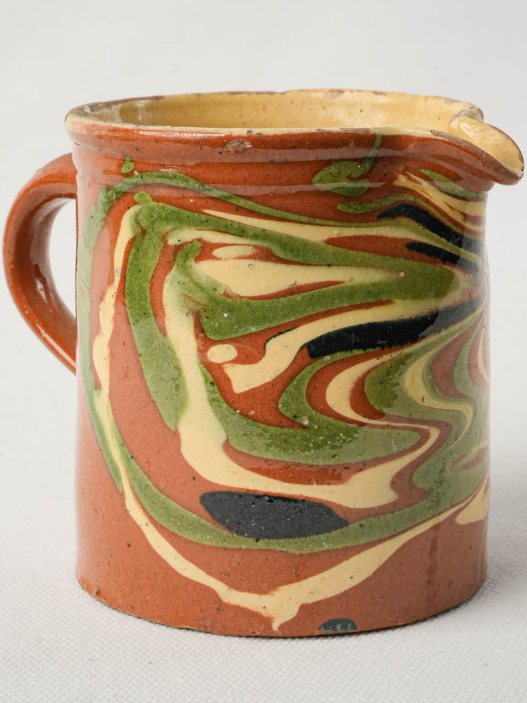 Intricate swirled pattern creamer