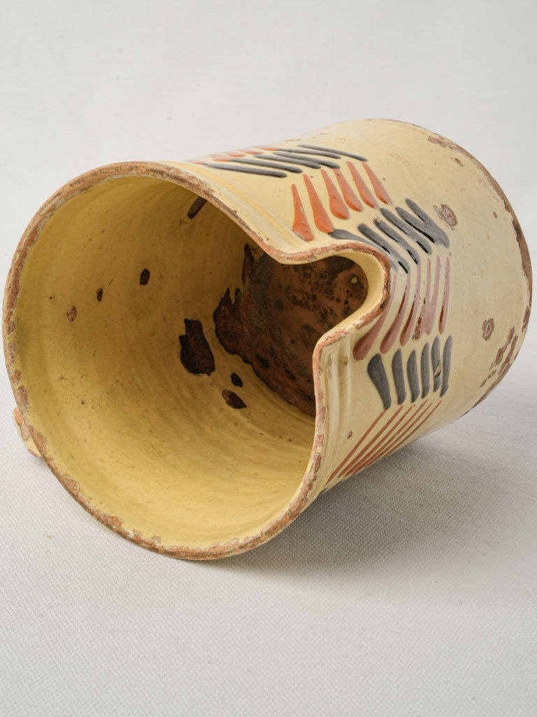 Pale yellow collectible art crock