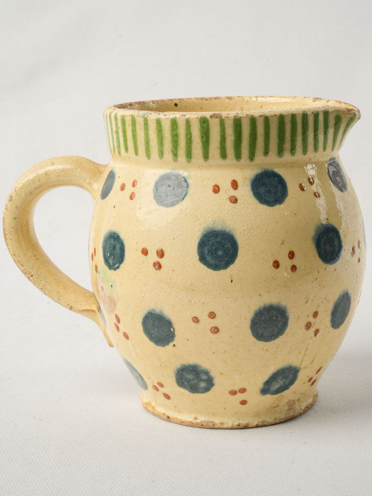 Whimsical colorful spotted terracotta vessel