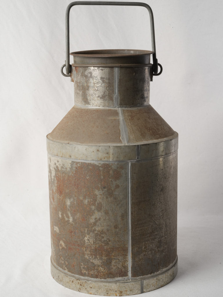 Tarnished tinplate milk churn