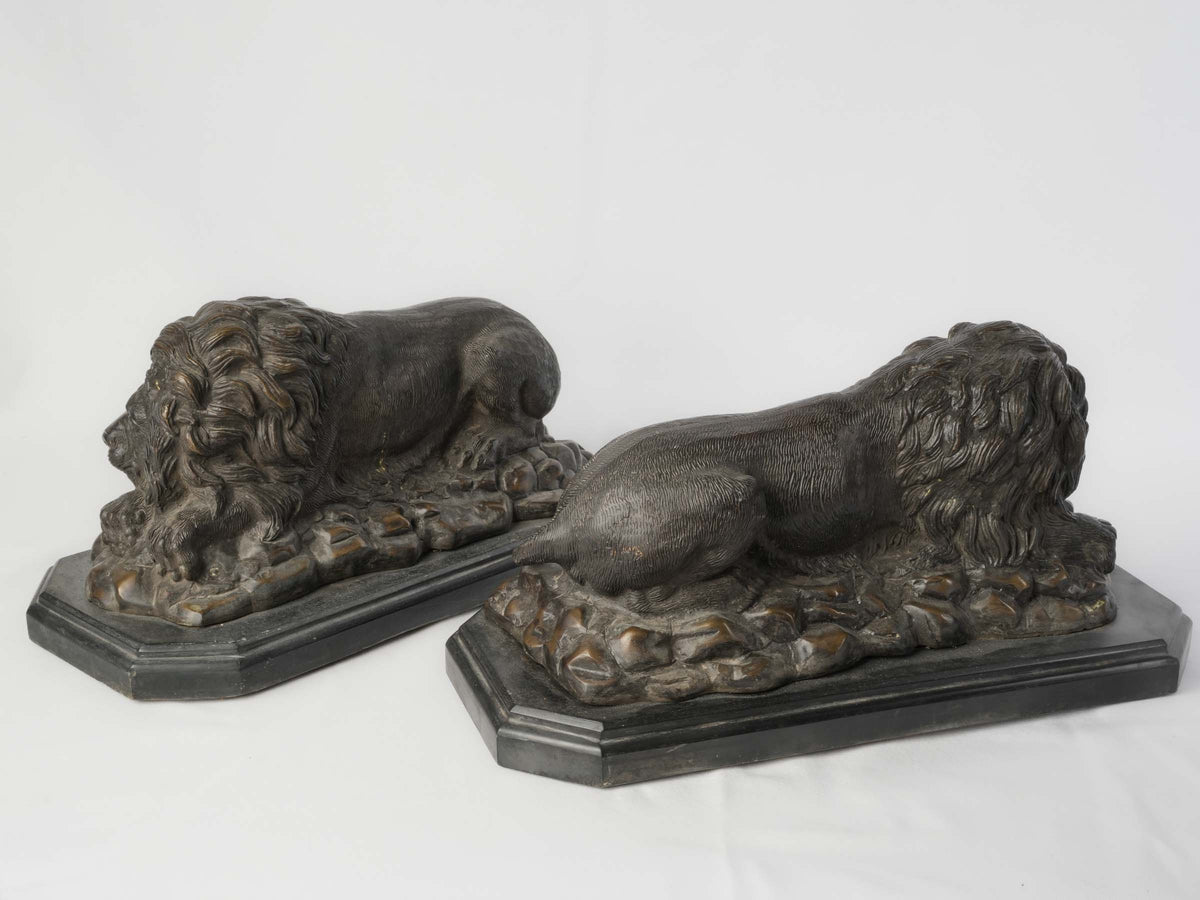 Naturalistic brown-black bronze lions
