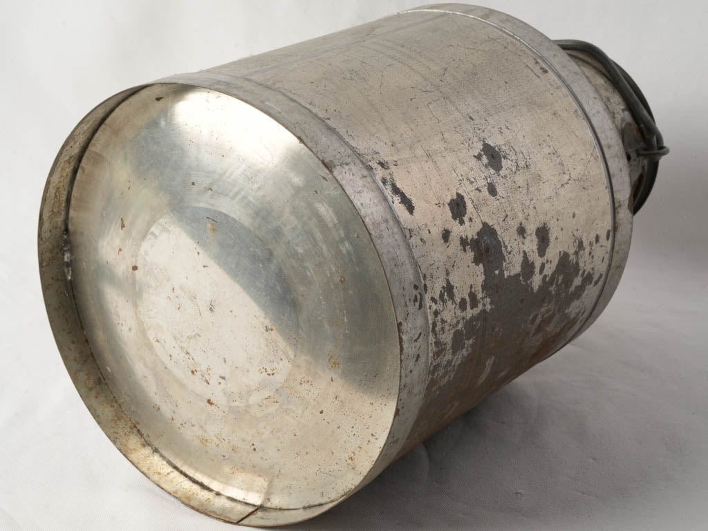 Old-world French tin milk churn