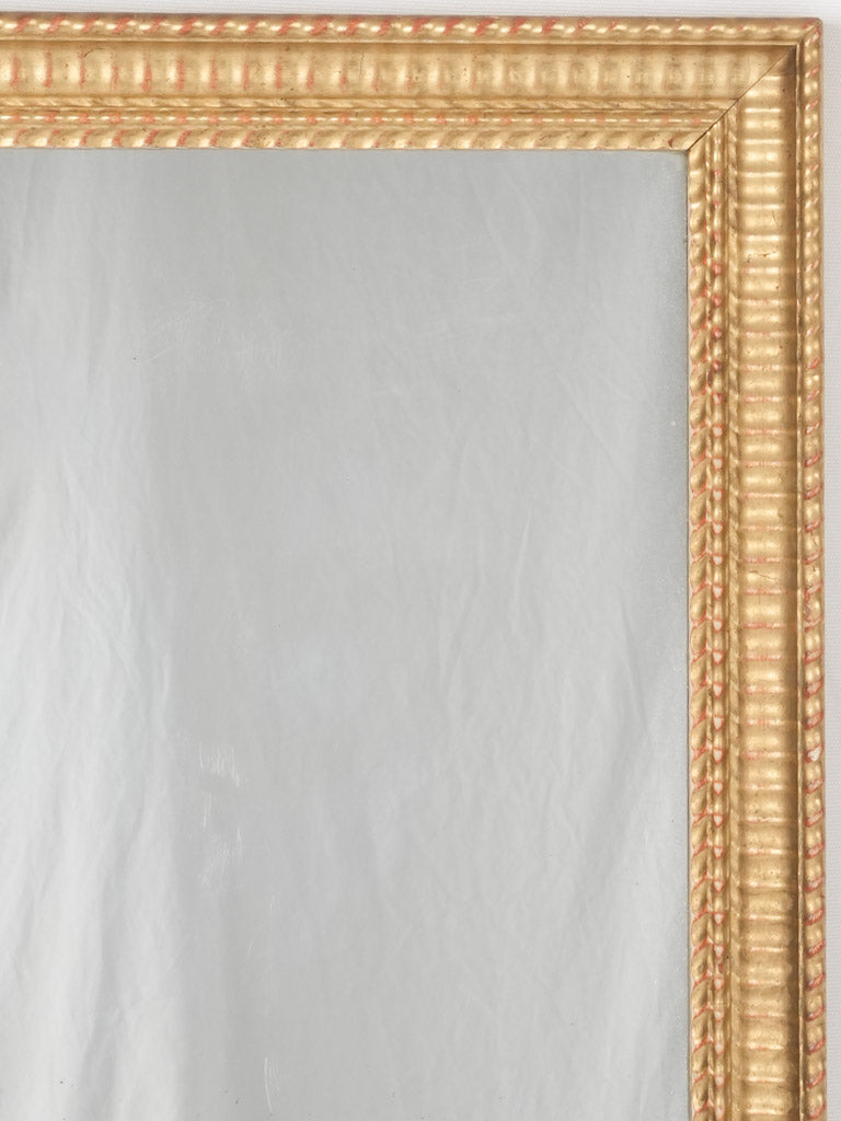 Ornate carved wood mirror frame
