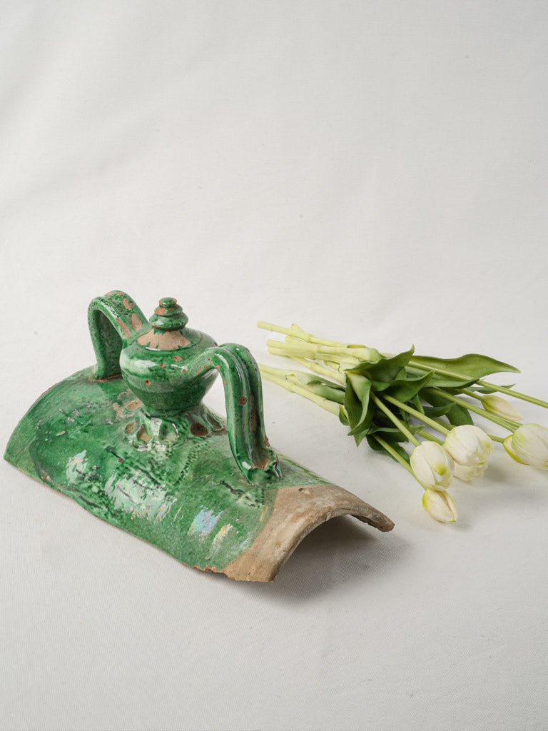 Ornate aged green roof tile