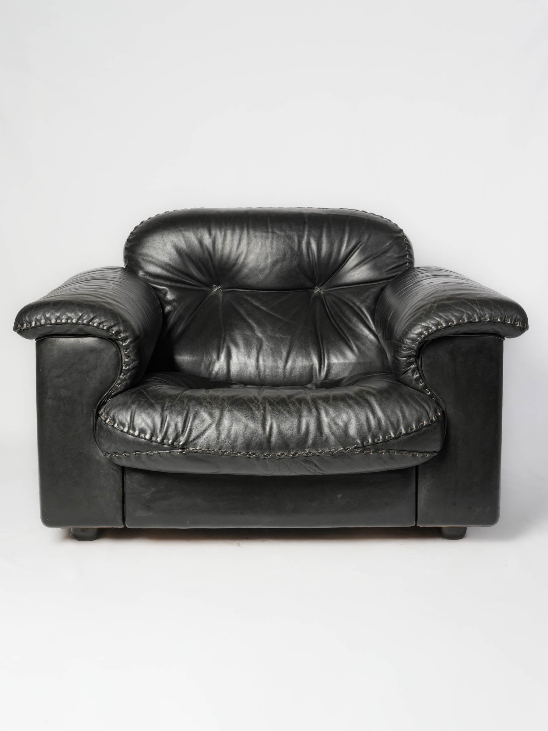 Black leather sculptural designed armchairs