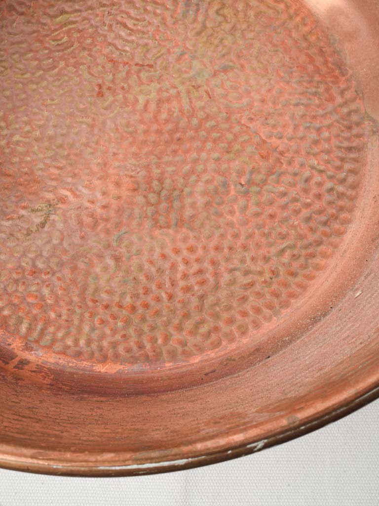 Artisanally worn copper kettle