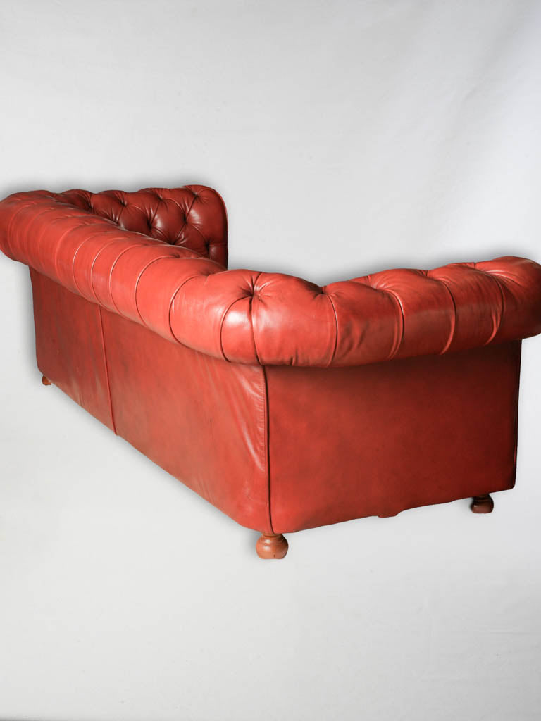 Handcrafted deep-red Chesterfield couch