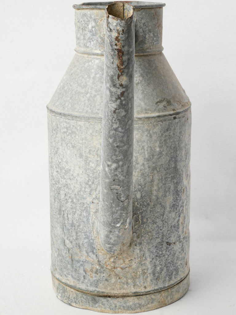 Aged weathered gray watering can