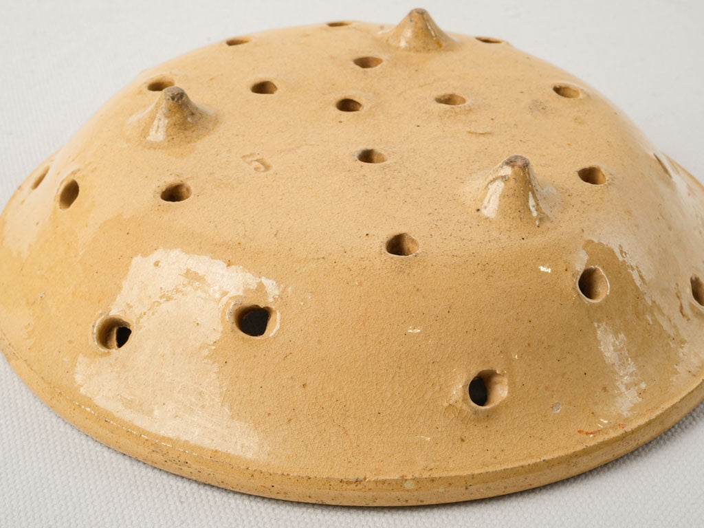 Rustic perforated terracotta colander