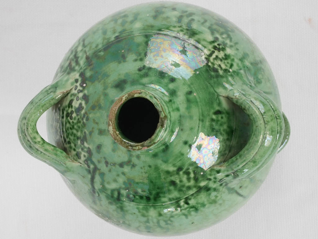 Traditional green-glazed pottery conscience jug