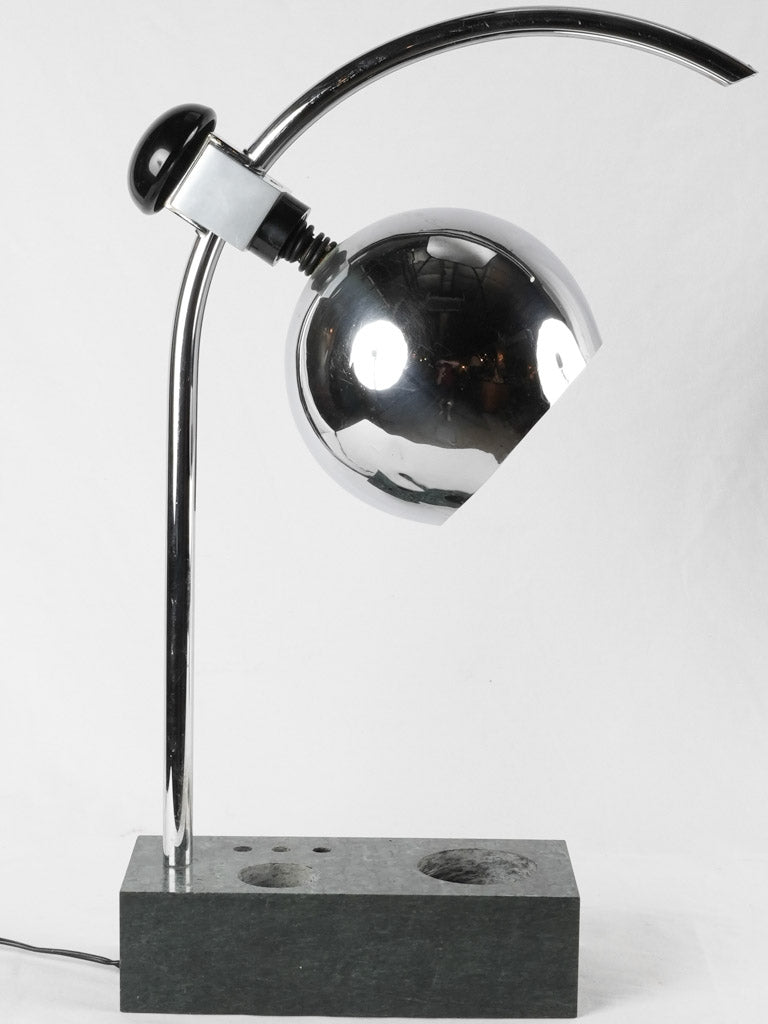Sleek chrome-finished artist-inspired table lamp