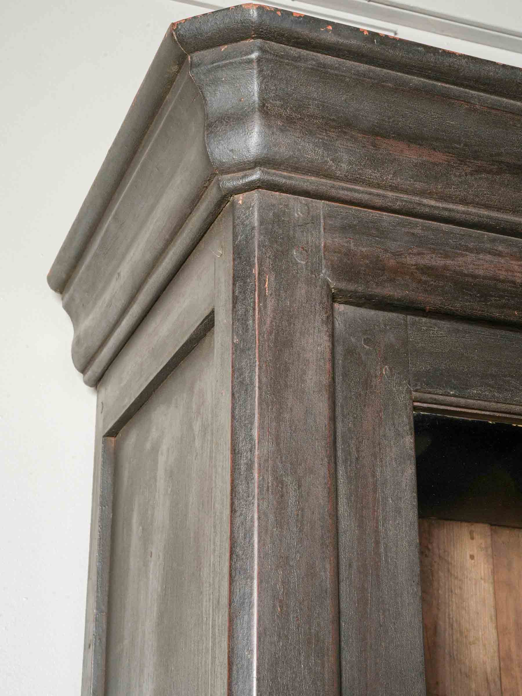 Refined narrow deep-black decor cabinet