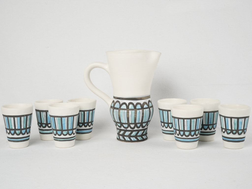 Renowned Capron terracotta pitcher with cups