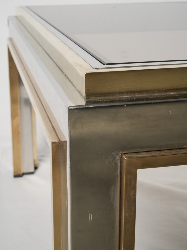 Sleek, layered chrome and glass table