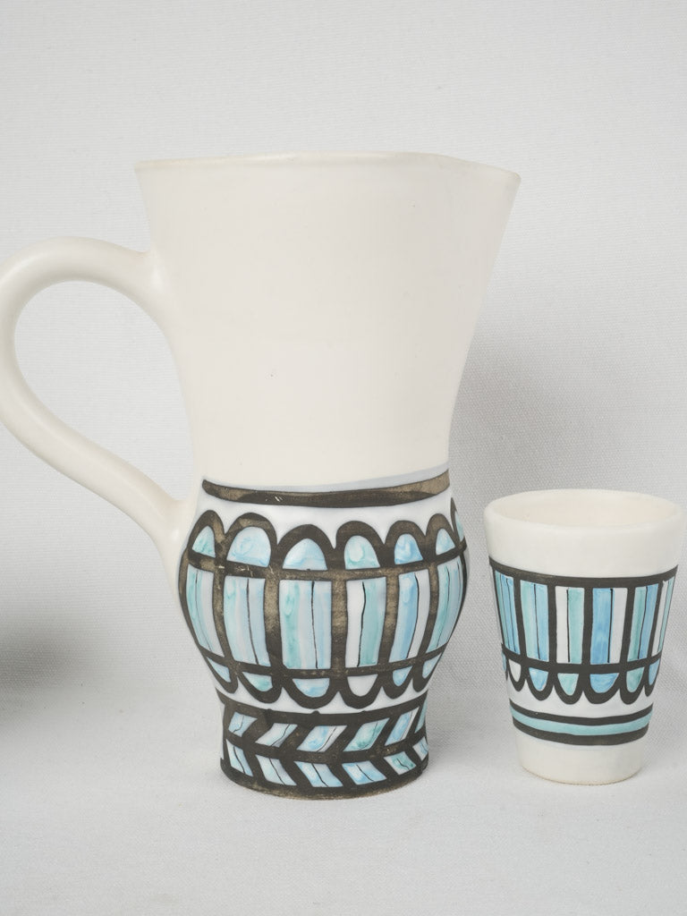 Artisanal terracotta pitcher with cups