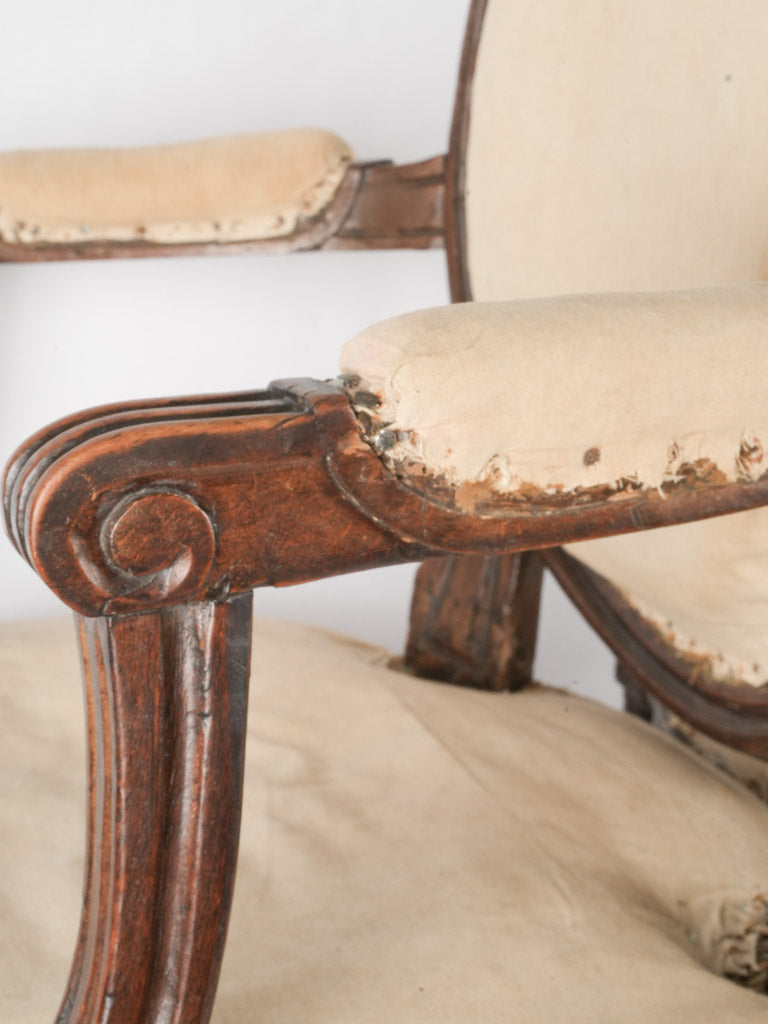Classic French-inspired walnut antique armchairs