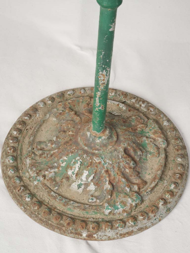 Aged, elegant green-patina garden table