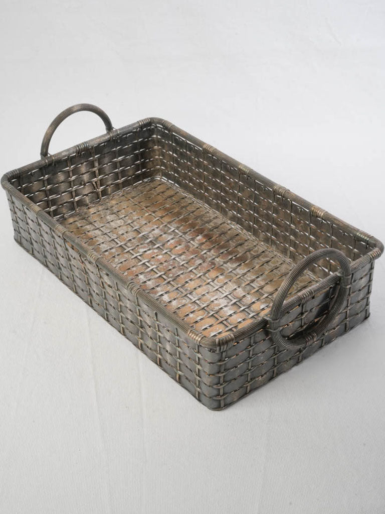 Elegant elongated rectangular metal basket.