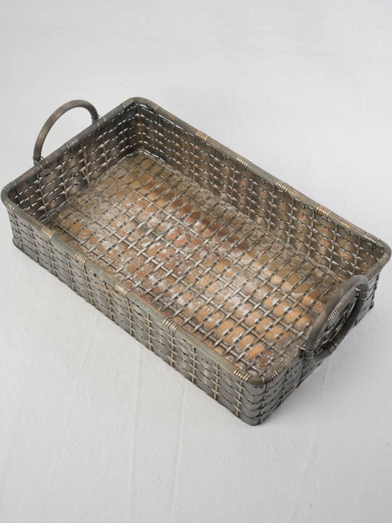 Patina-finished antique tray basket.