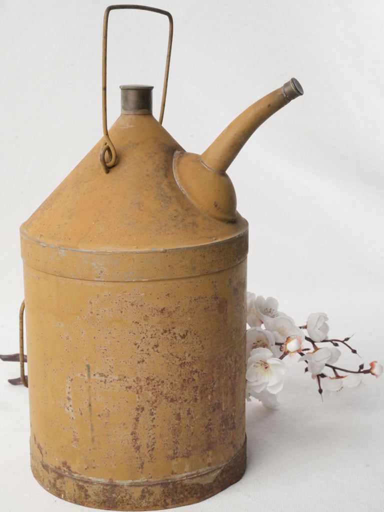 Vintage ochre-painted metal jug