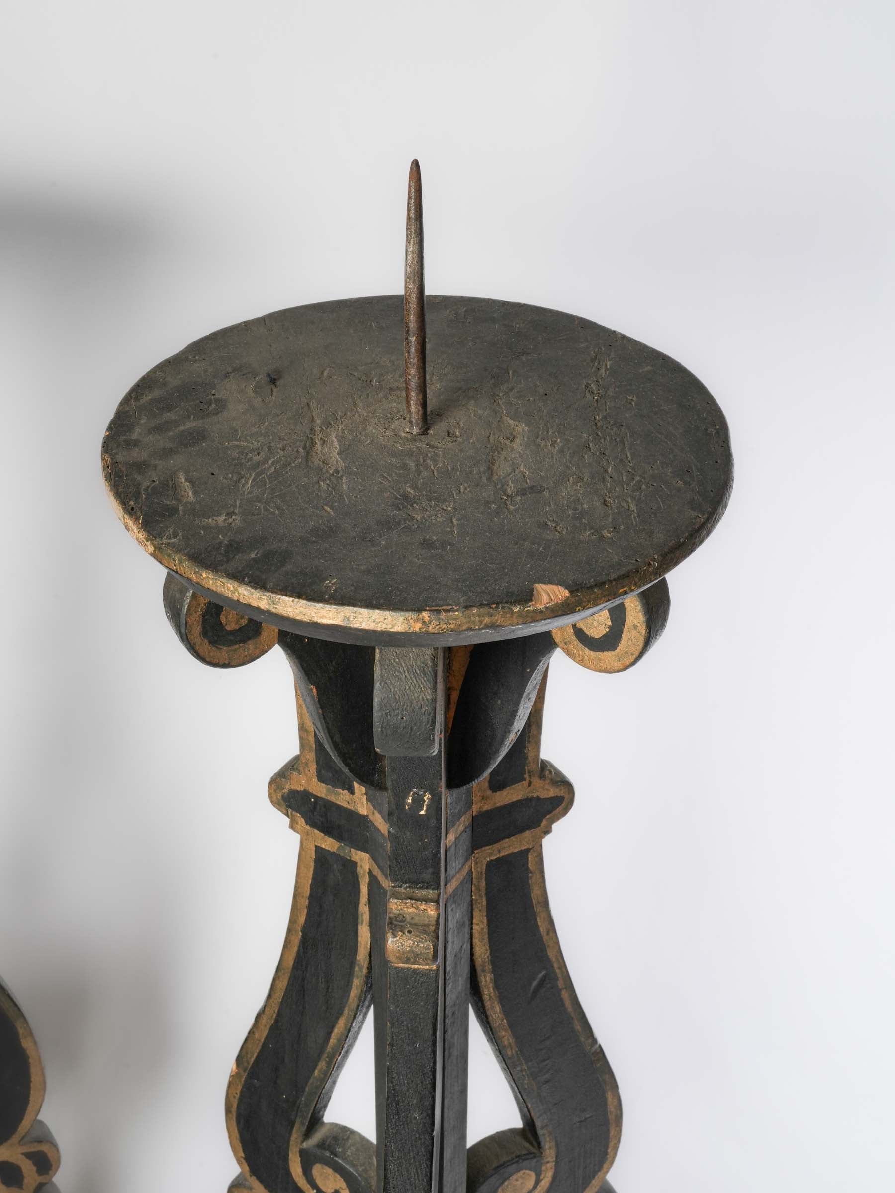 Elegant voluted openwork candle supports