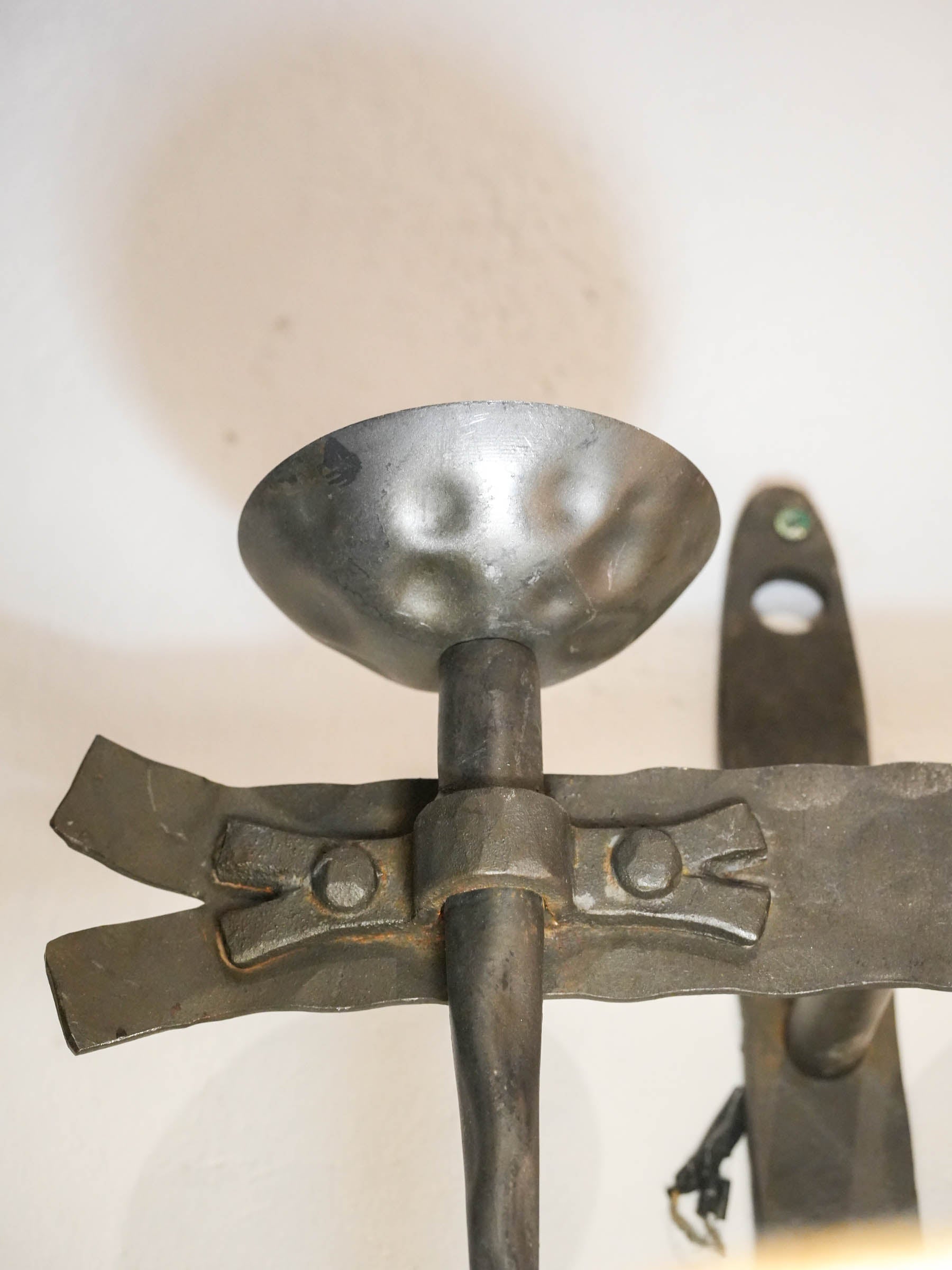 Patinated medieval-inspired wall sconces