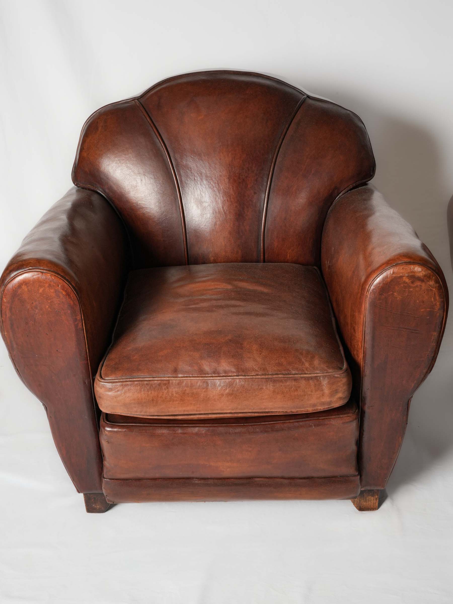 Deep tan leather club chairs