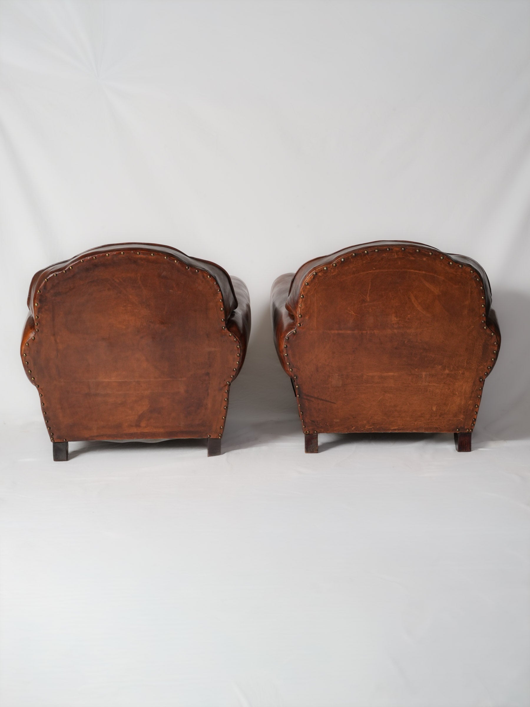 Restored antique leather armchairs elegant