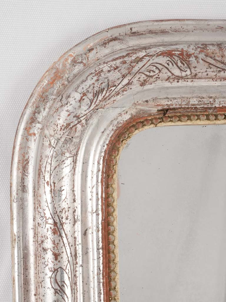 Classic red accented gilded mirror