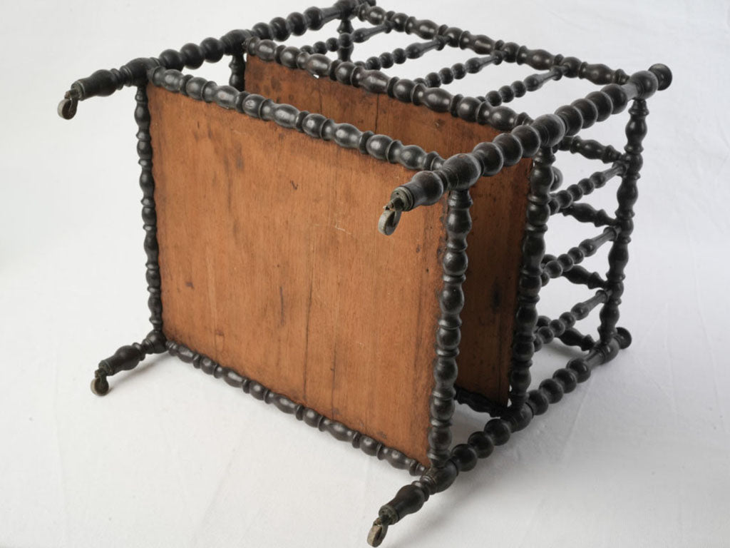 Patina-aged ebonised canterbury stand