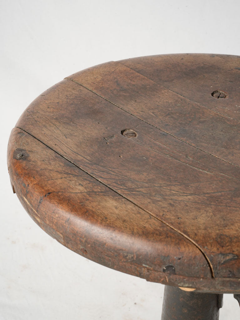 Compact antique cast iron stool