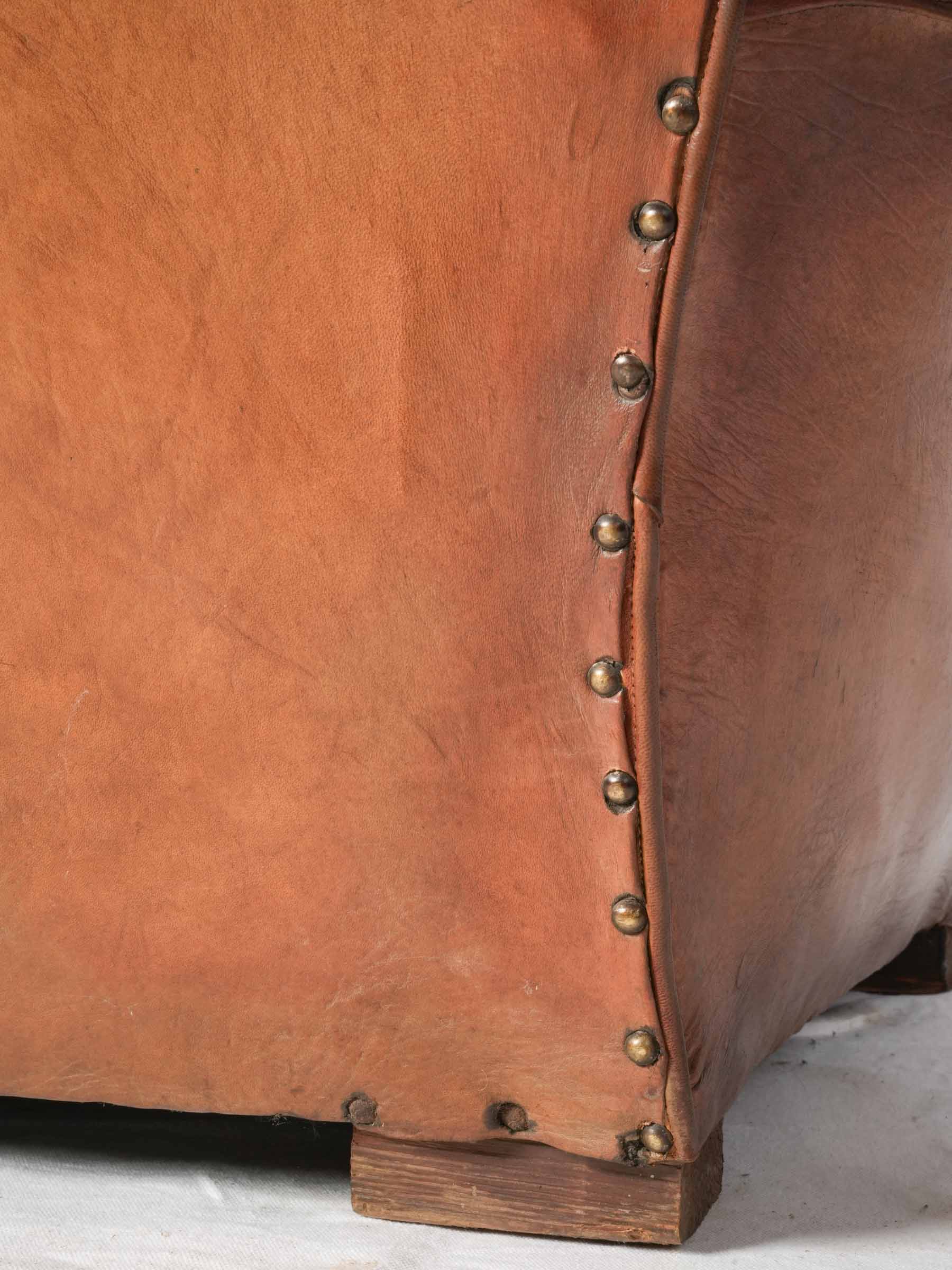 Stylish aged leather club chair