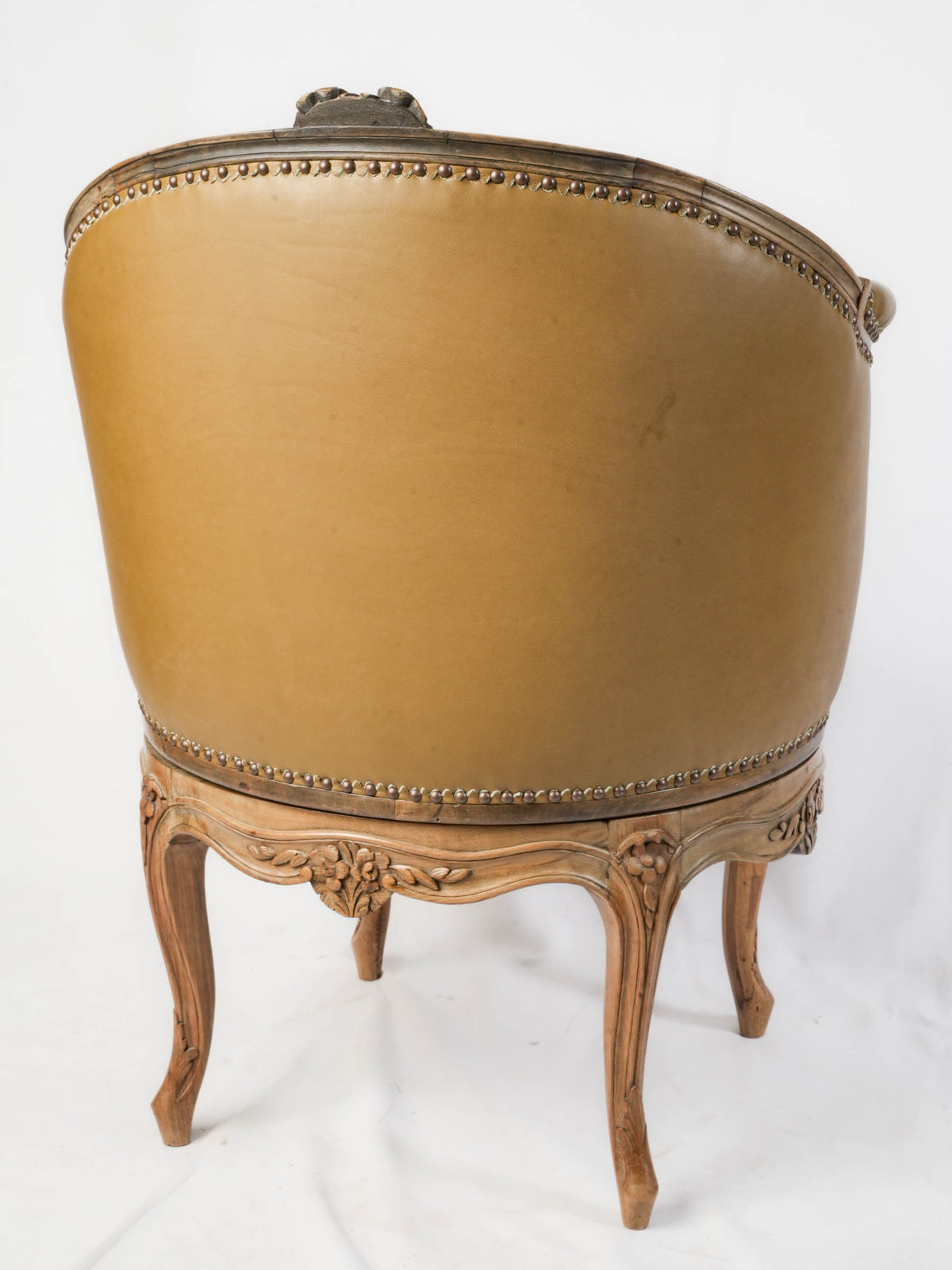 Refined walnut tub-back armchair