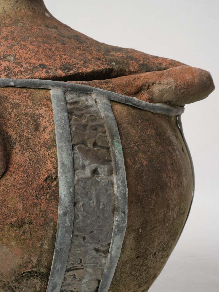 Patina-coated ceramic jar