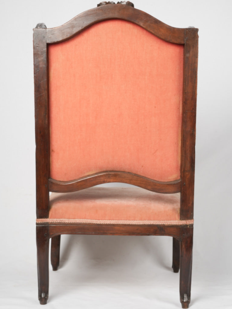 Intricate velvet-upholstered French antique bergère