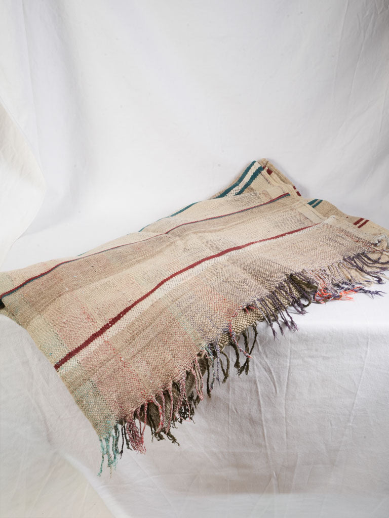 Frayed tasseled striped blanket