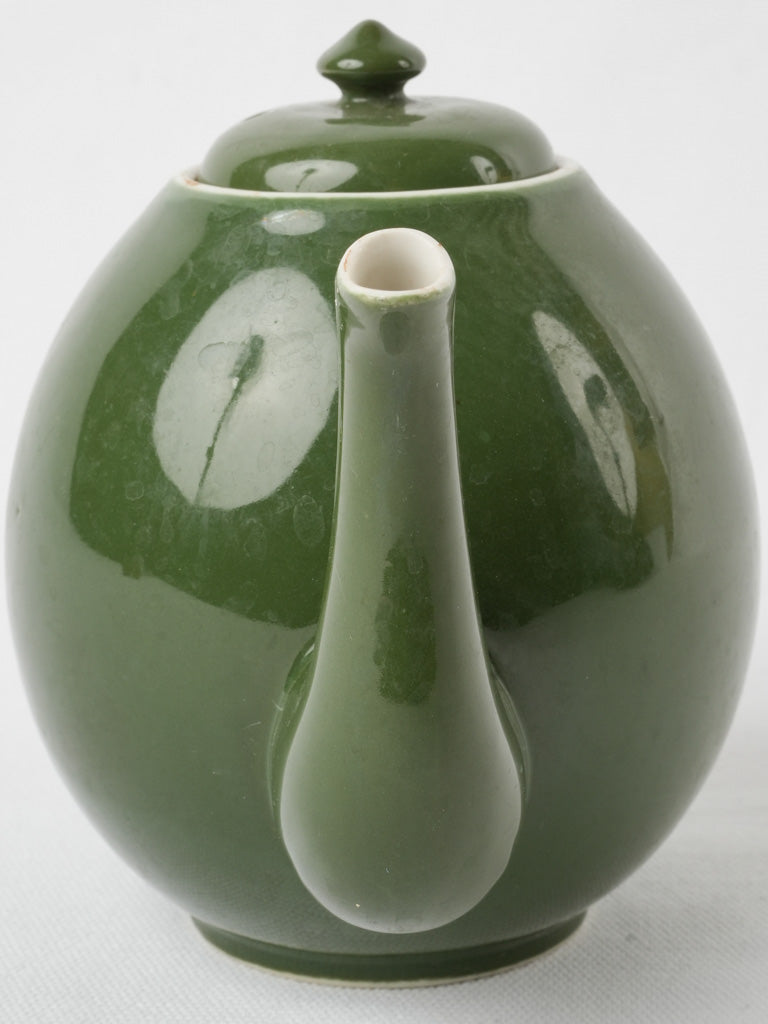 Well-loved dark green teapot