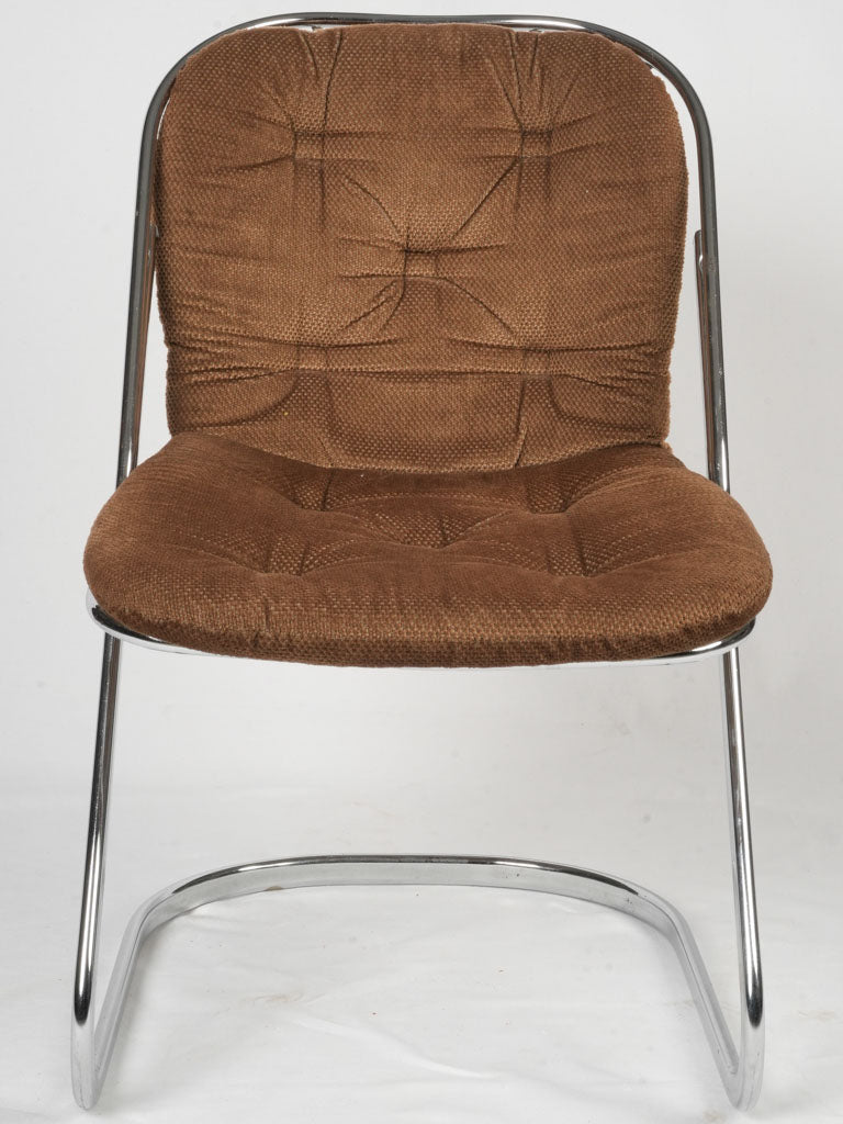 Sleek chrome cantilever chairs
