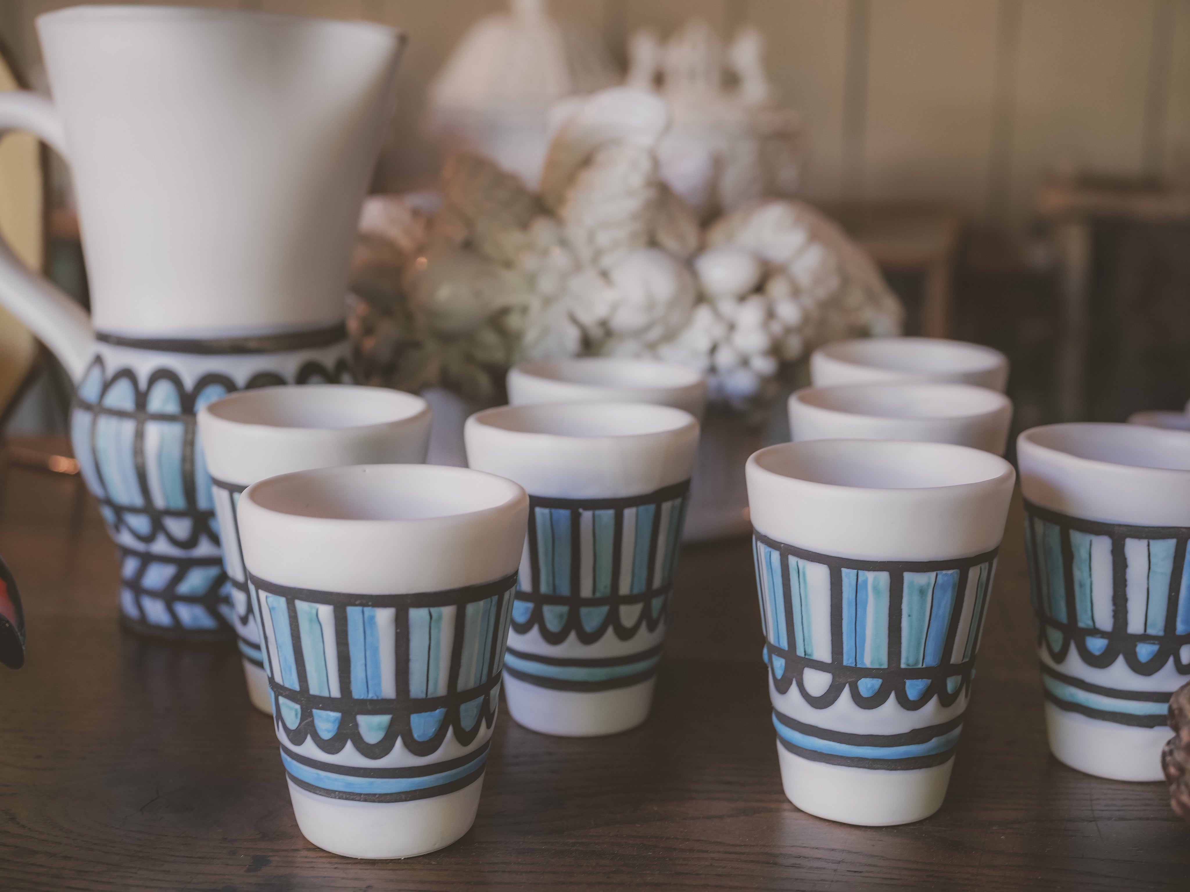 Ceramic orangeade service with geometric designs