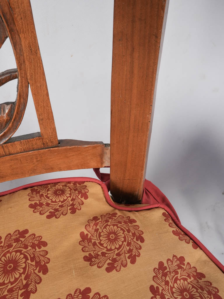 Stylized bird-engraved dining chairs