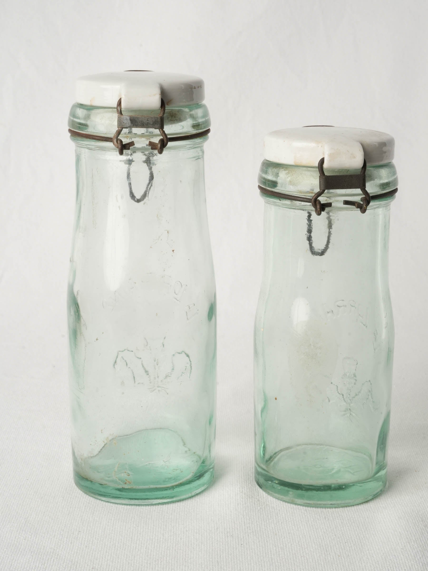 Graduated Pair of French "La Lorraine" Embossed Glass Preserving Bottles, 1930s–1950s - 10¾"