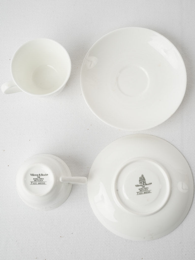 White China tea cups and saucers.