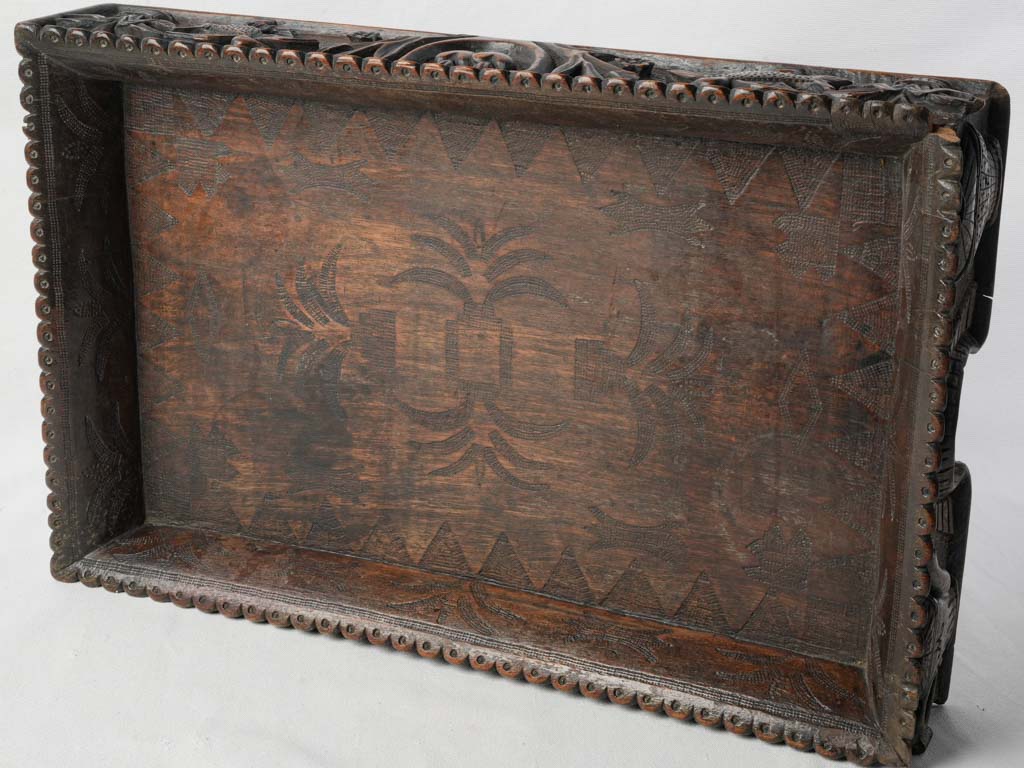 Richly symbolic carved tray