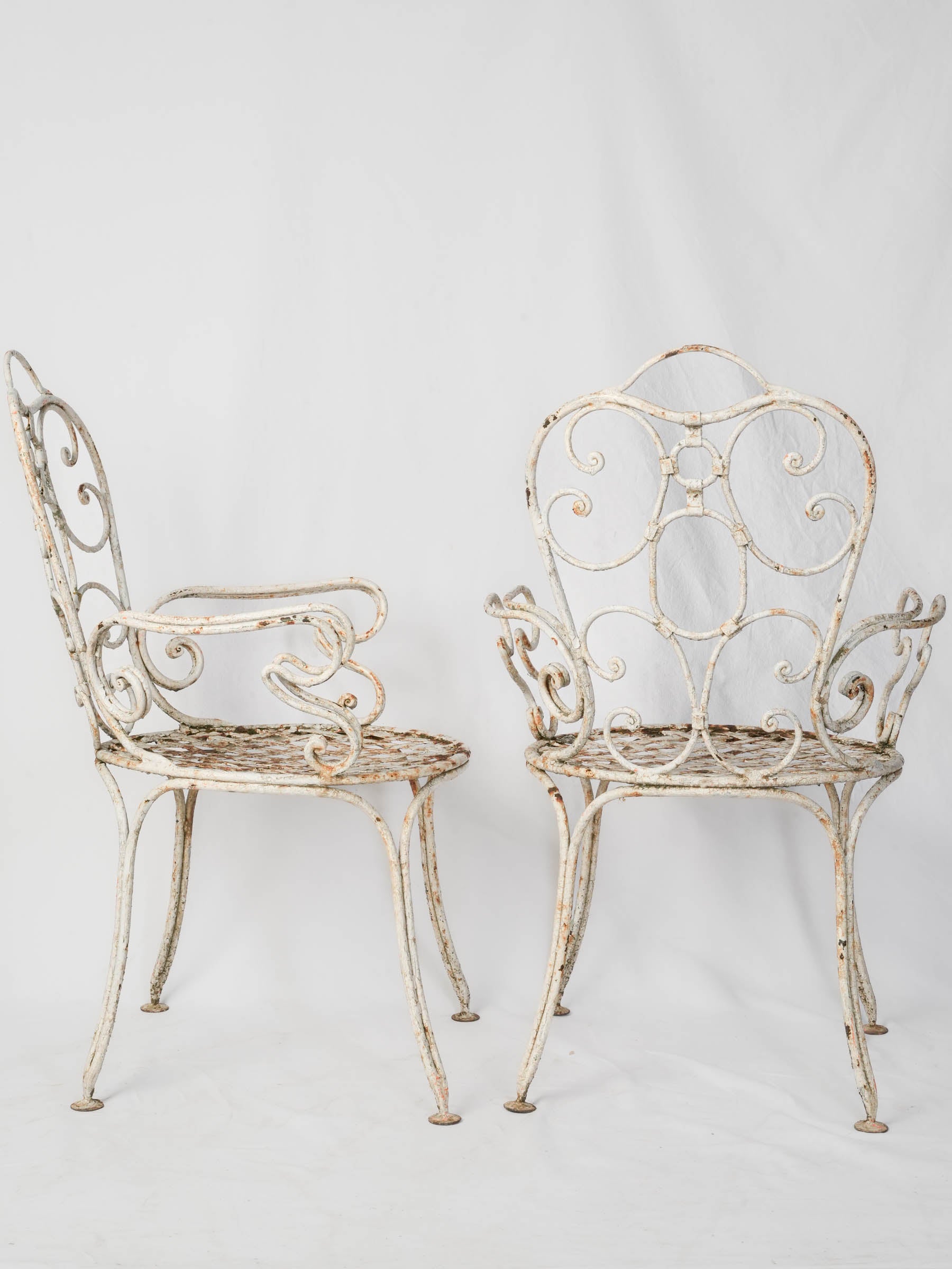 Elegant French wrought iron armchairs