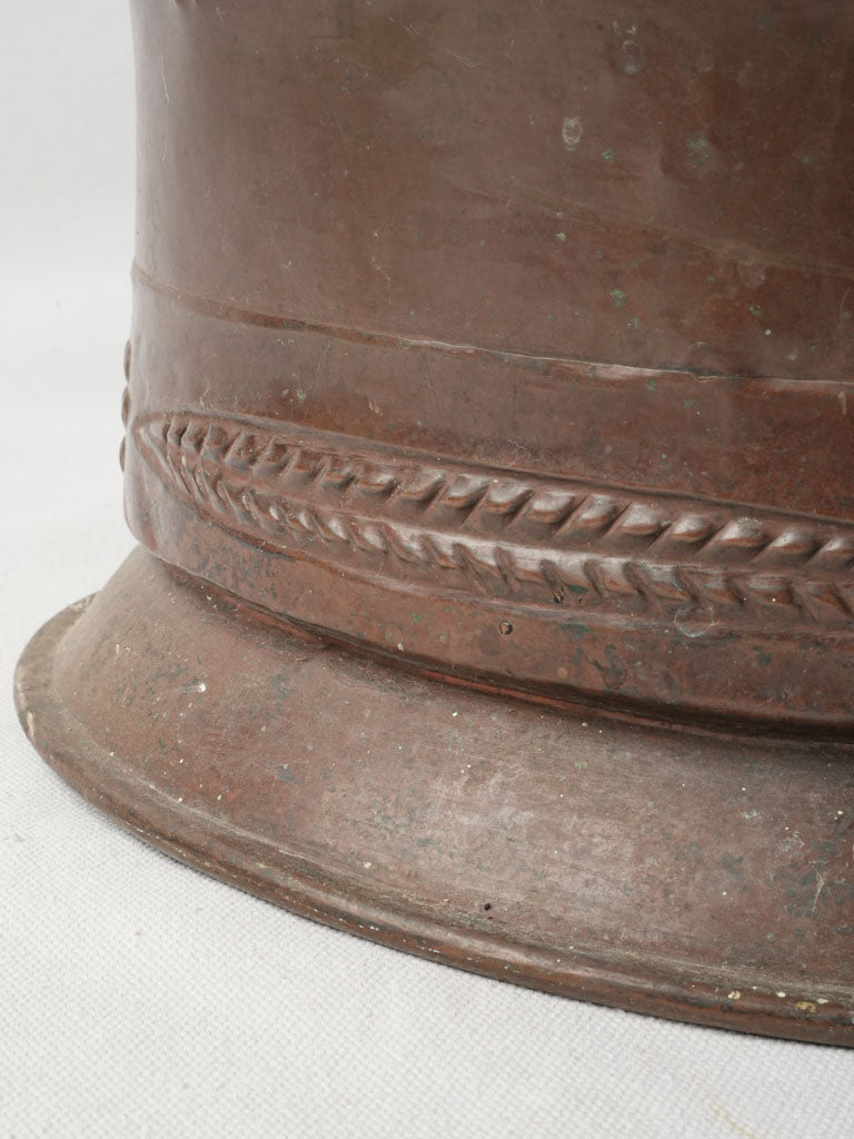 Warm-hued aged copper pot