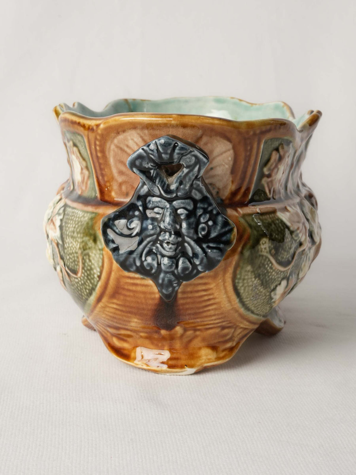 Richly sculpted earthenware garden pot