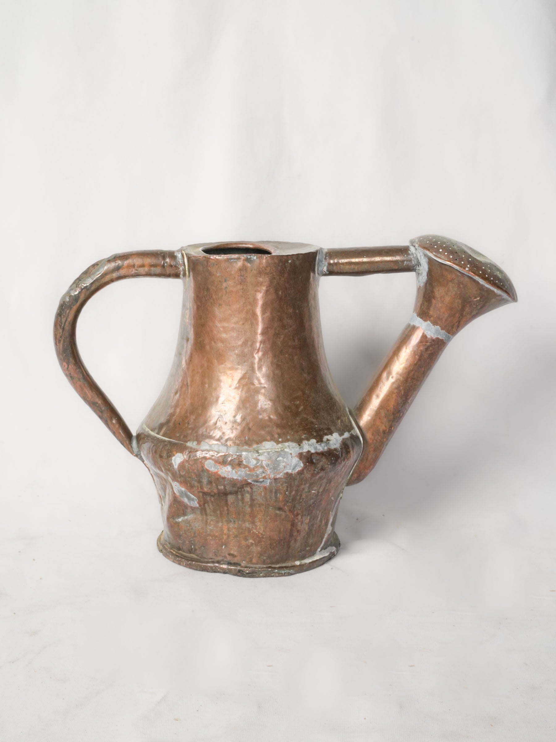 Antique sculptural watering can