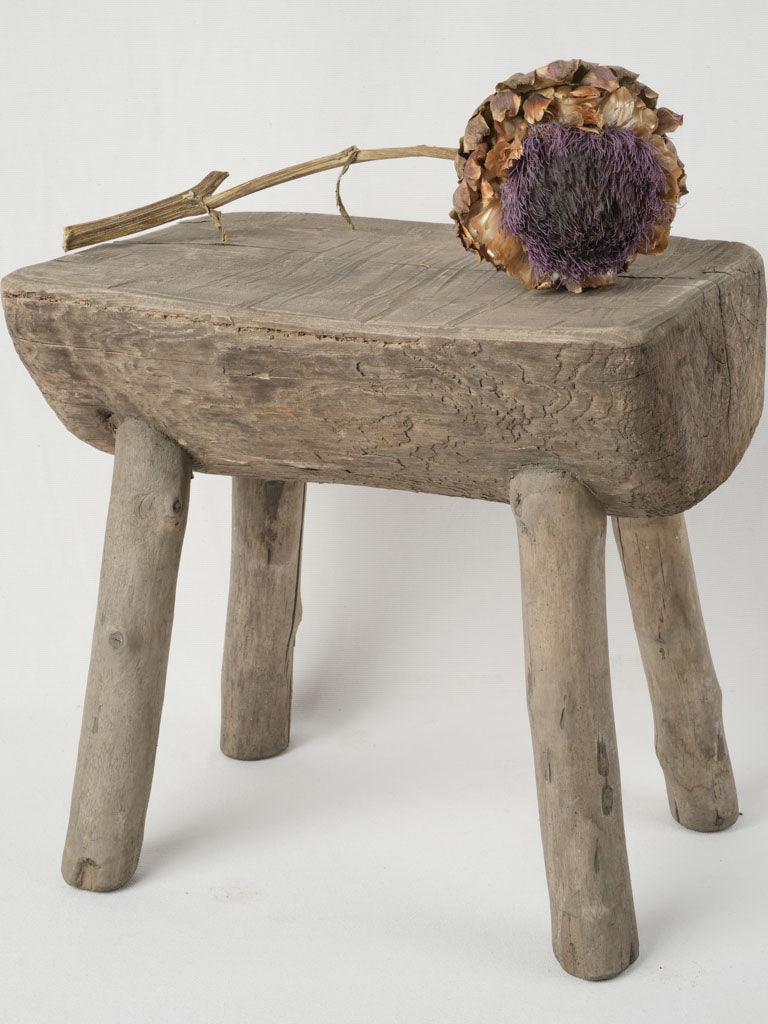Rustic salvaged half log branch stool